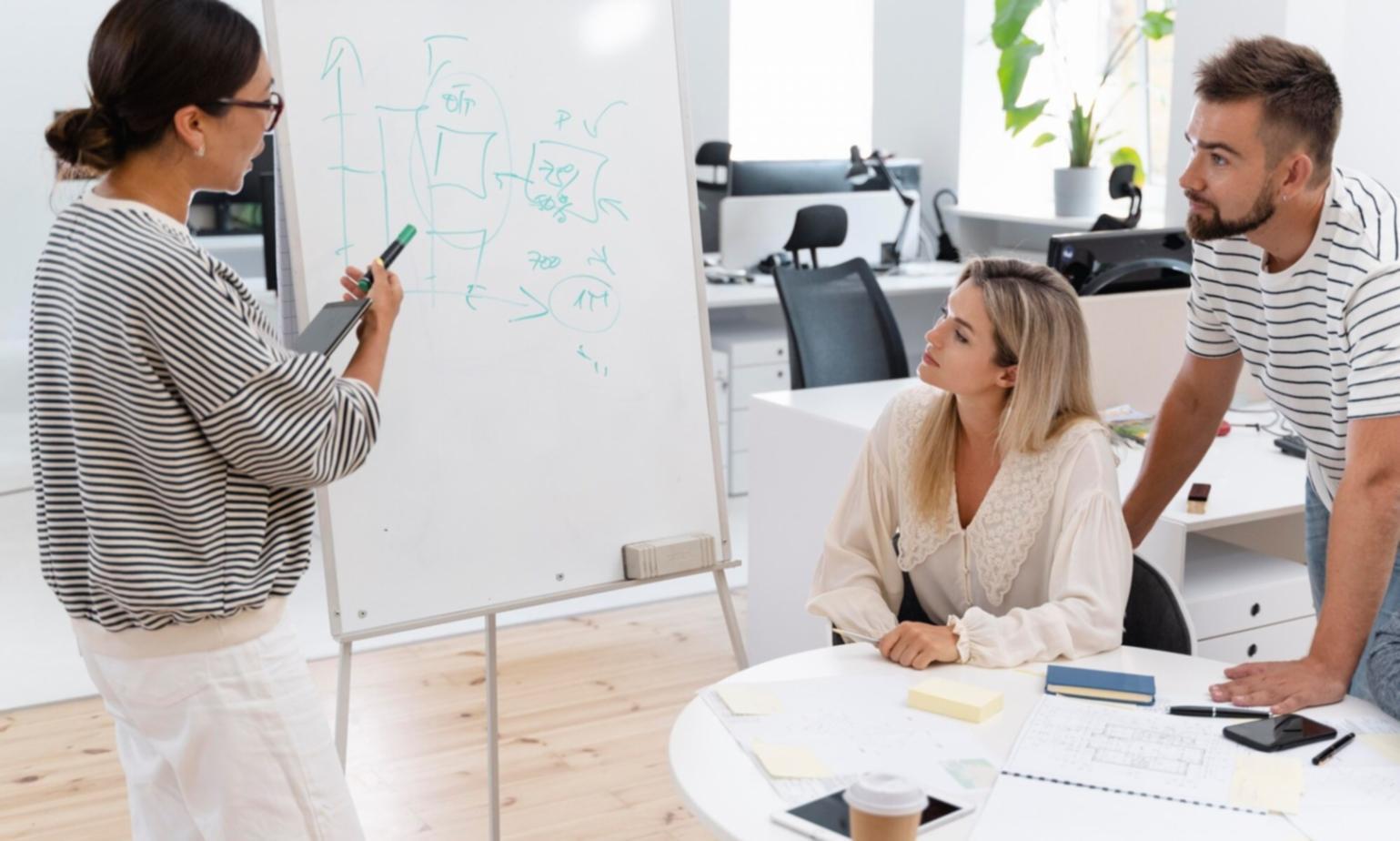 Startup founder working with financial documents and laptop