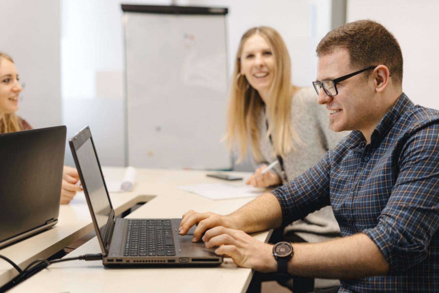 Strategic planning session with startup founders reviewing fundraising materials