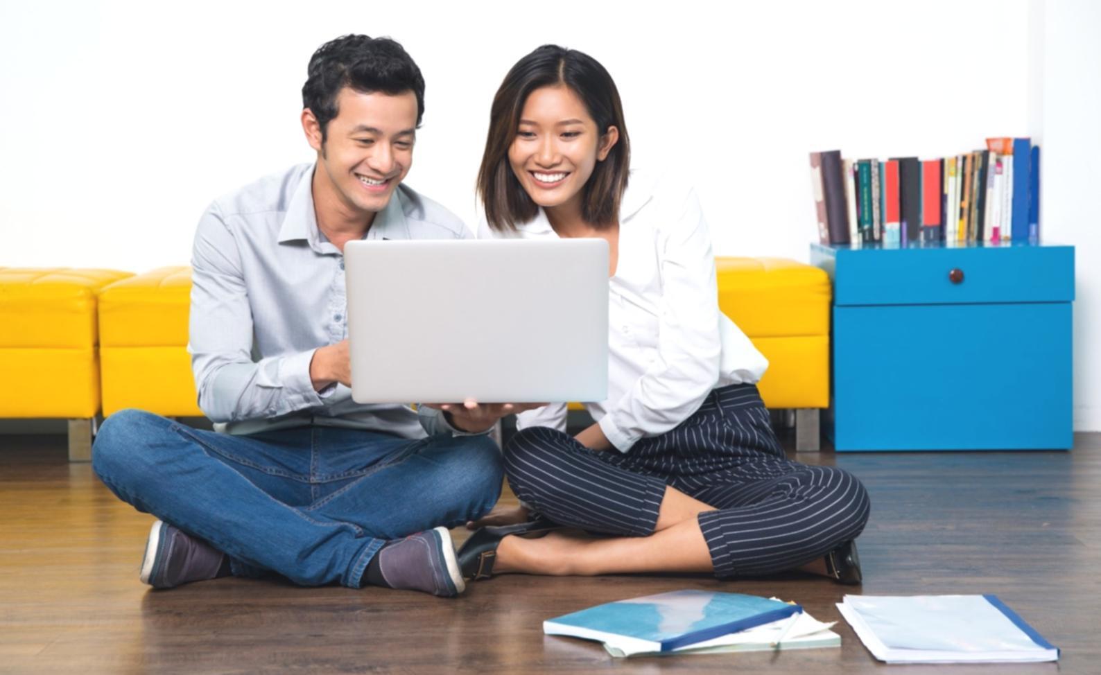 Detailed financial projections and investor deck materials spread across a meeting table